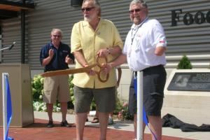 Donor Denny Elwell and Fair Board President Gary VanAernam cut the ribbon