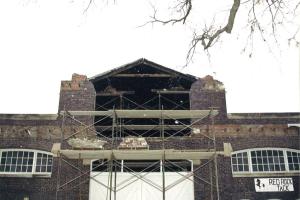 Replacing the second story window above the east entrance