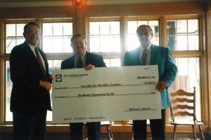Receiving the donation check from Pella Corporation for renovations